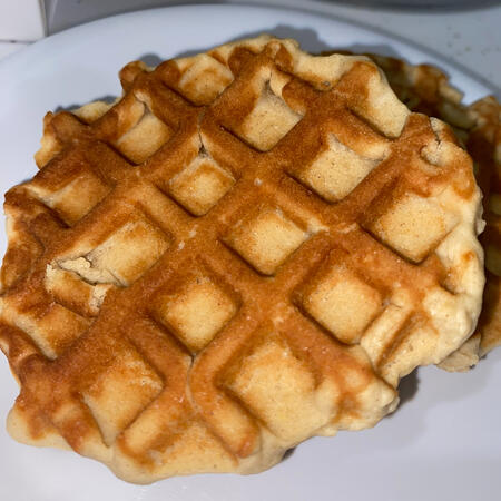 Waffle Cookie - A buttery cookie cooked in an actual waffle iron, served with a small cup of maple syrup.