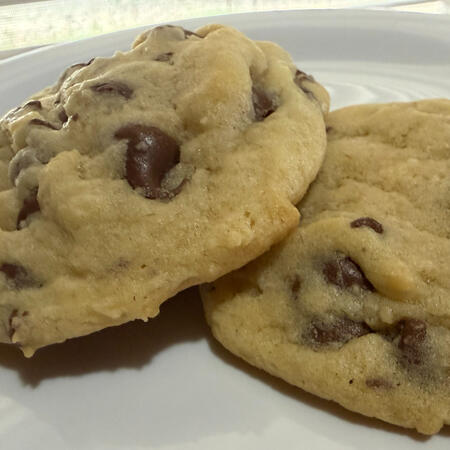 Chocolate Chip - A classic, golden-brown cookie with a soft, chewy center, and rich chocolate chips in every bite.